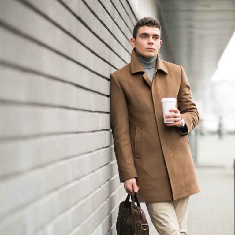 man-brown-coat-with-coffee
