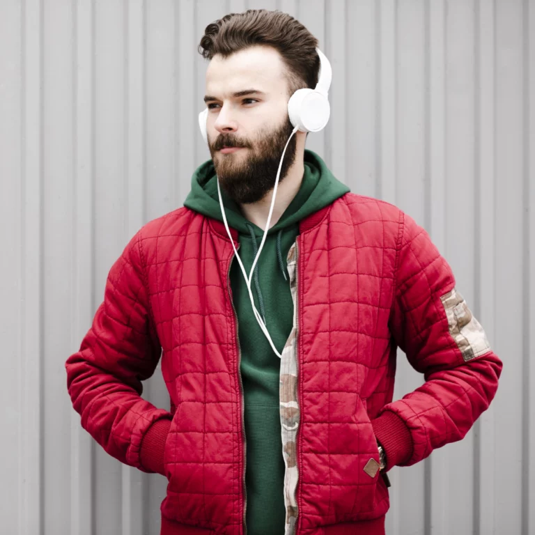 medium-shot-guy-with-white-headphones-looking-away